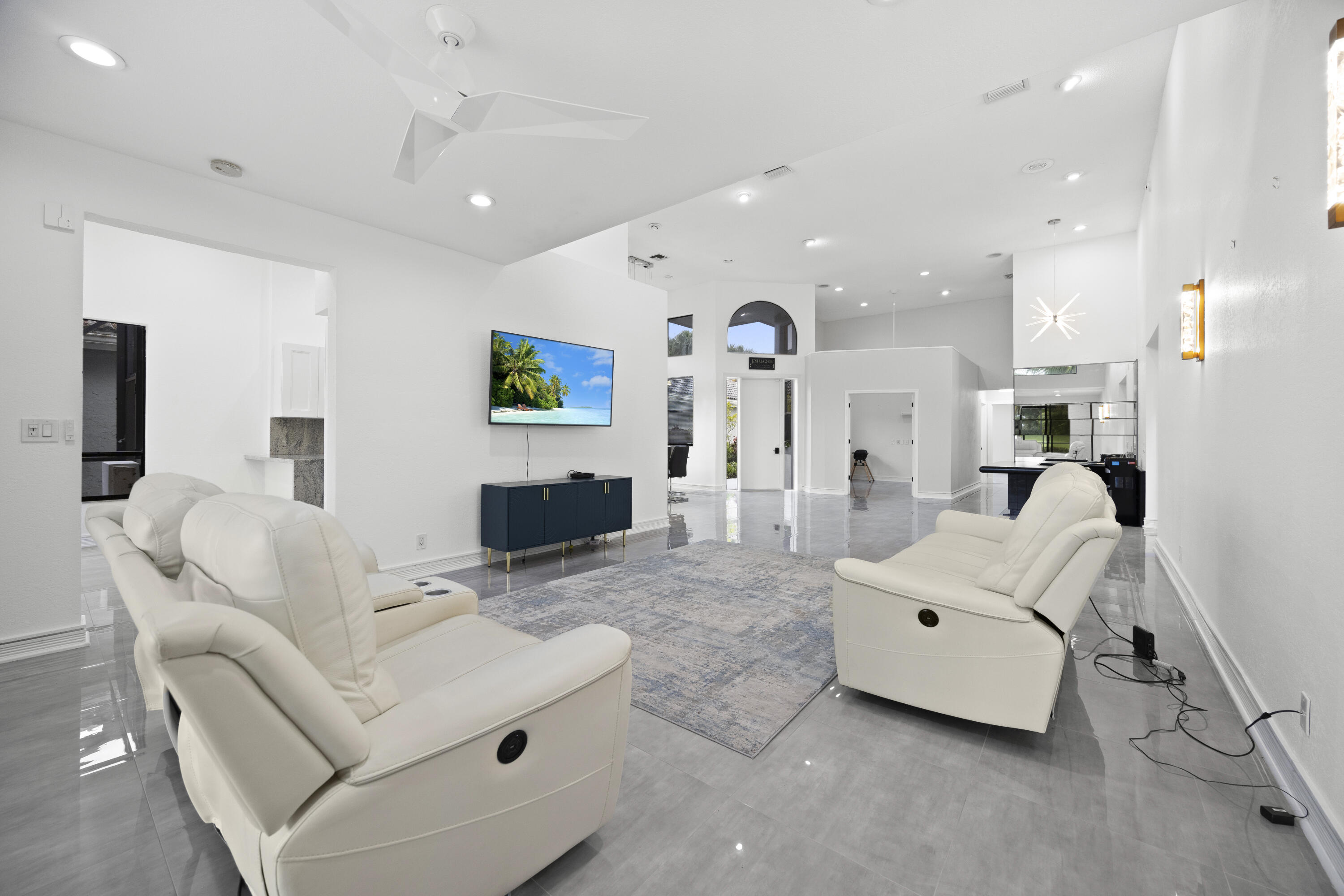 10106 Spyglass Way Boca Raton, FL 33498 - Photo 33 of 56 a living room with furniture and a flat screen tv