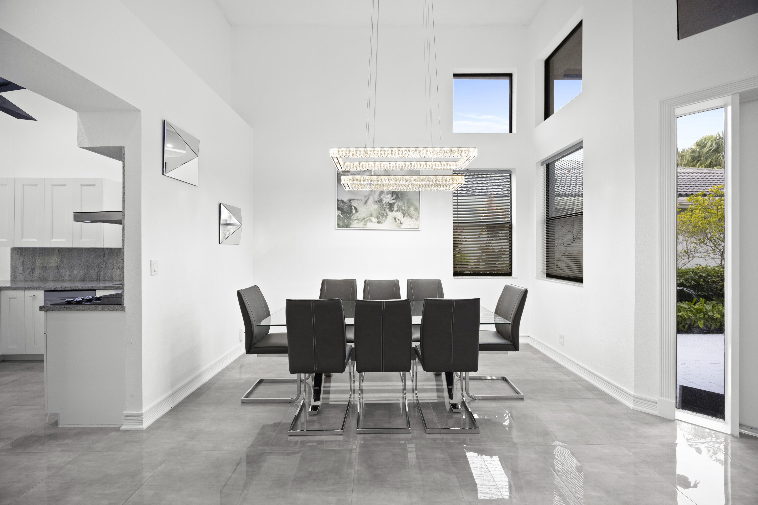 10106 Spyglass Way Boca Raton, FL 33498 - Photo 41 of 56 a view of a dining room with furniture and a window
