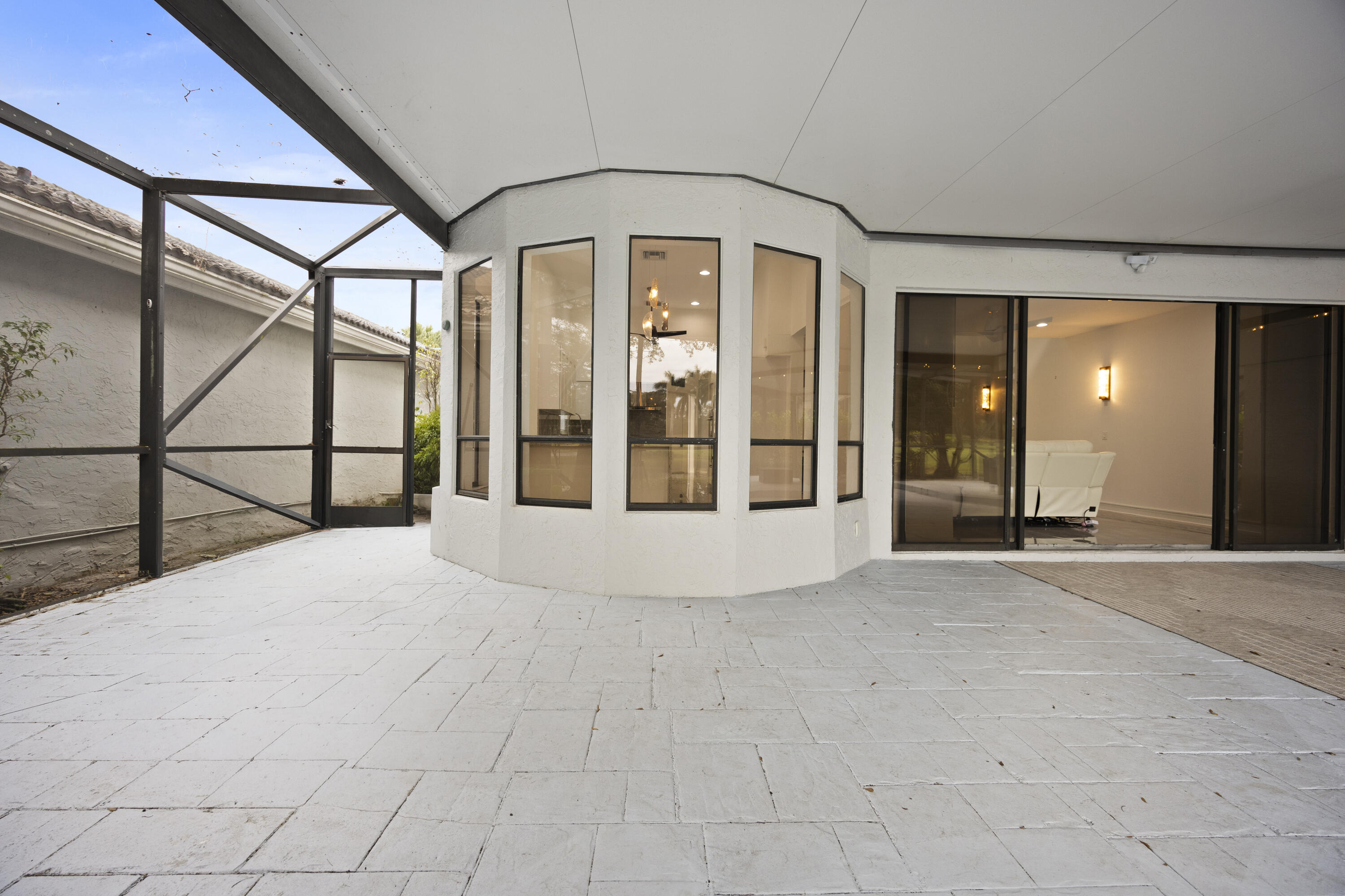 10106 Spyglass Way Boca Raton, FL 33498 - Photo 50 of 56 a view of an empty room with glass door