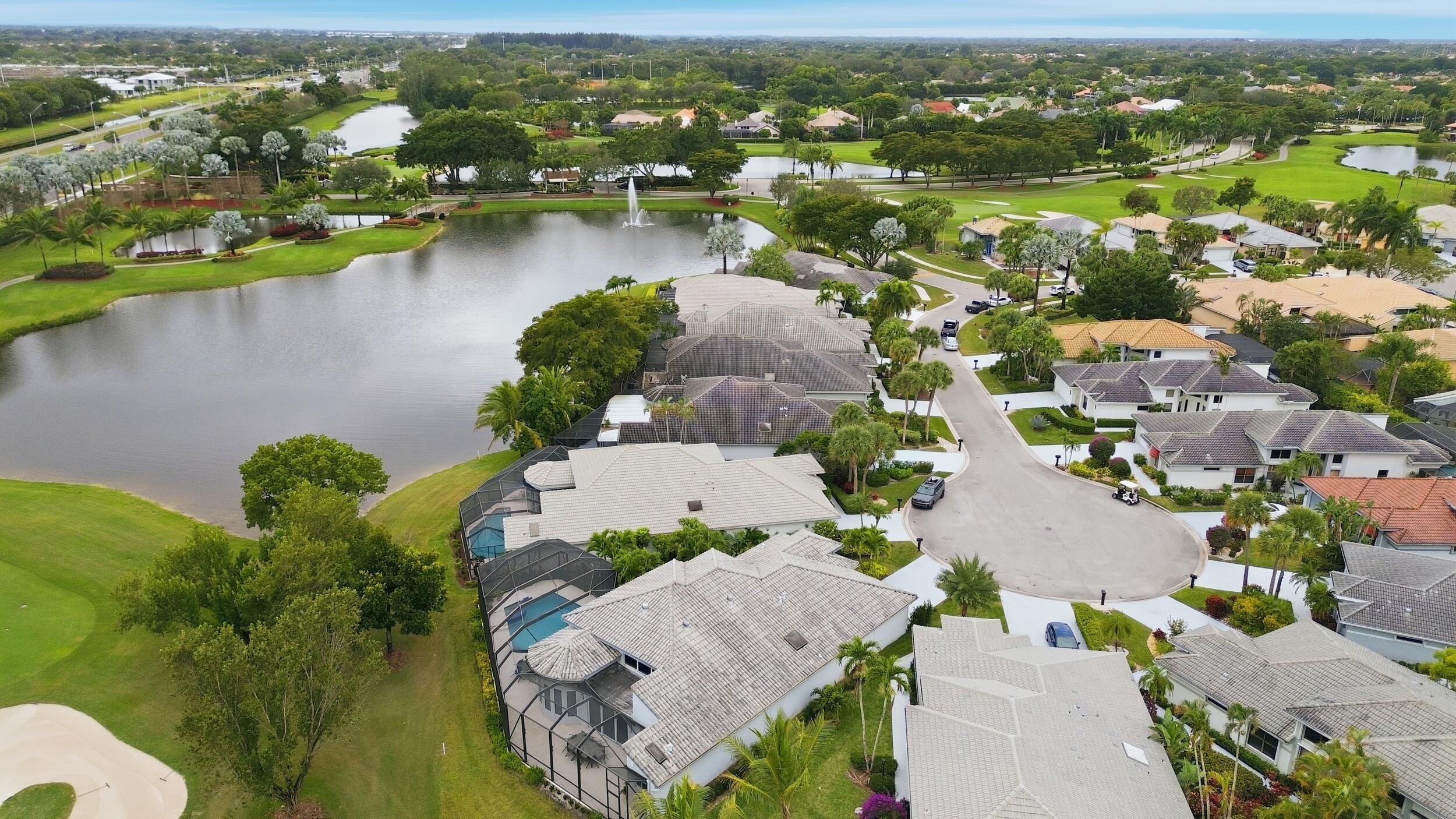 10106 Spyglass Way Boca Raton, FL 33498 - Photo 54 of 56 an aerial view of residential houses with outdoor space and lake view