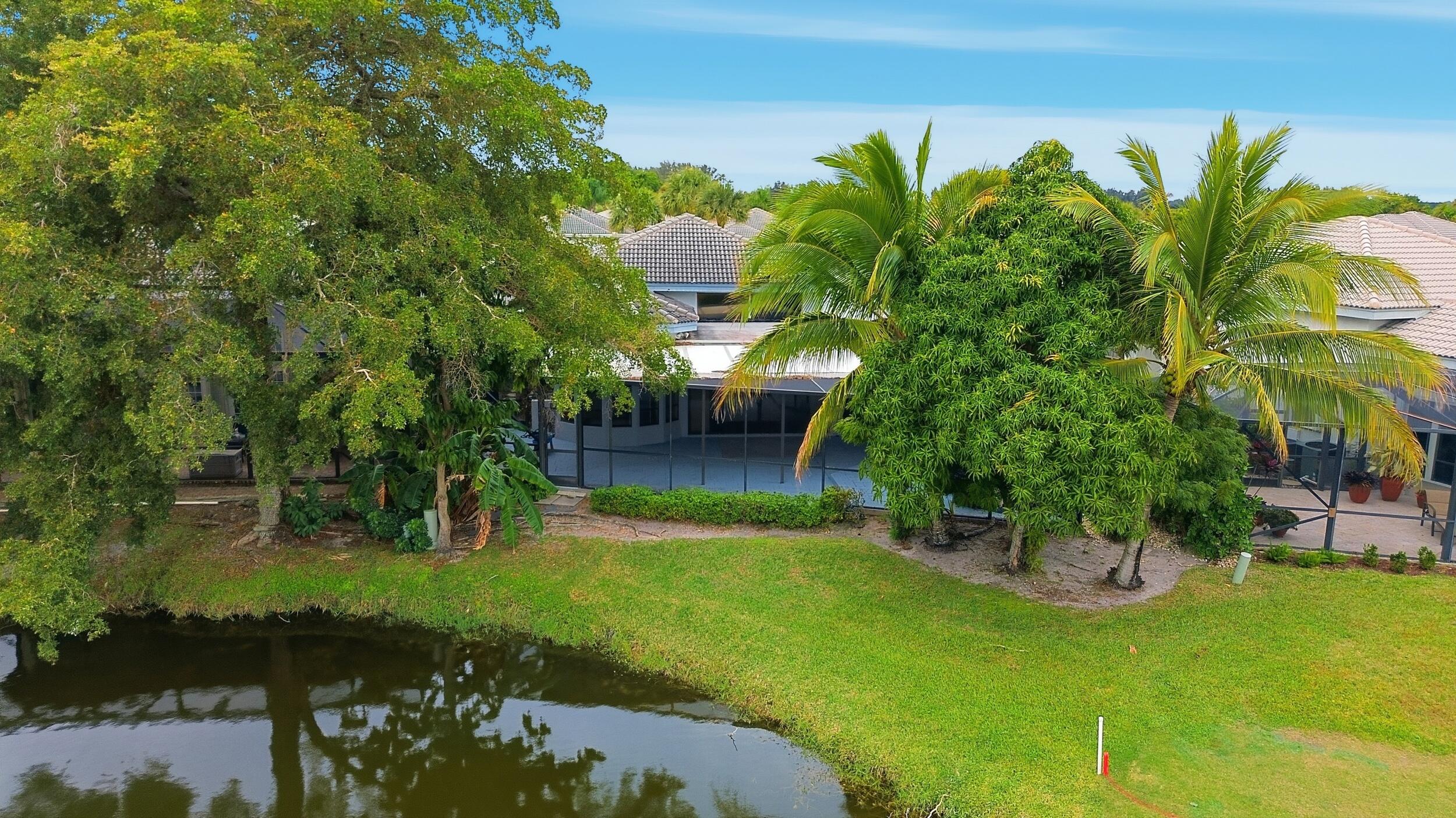 10106 Spyglass Way Boca Raton, FL 33498 - Photo 56 of 56 a view of a garden with a lake