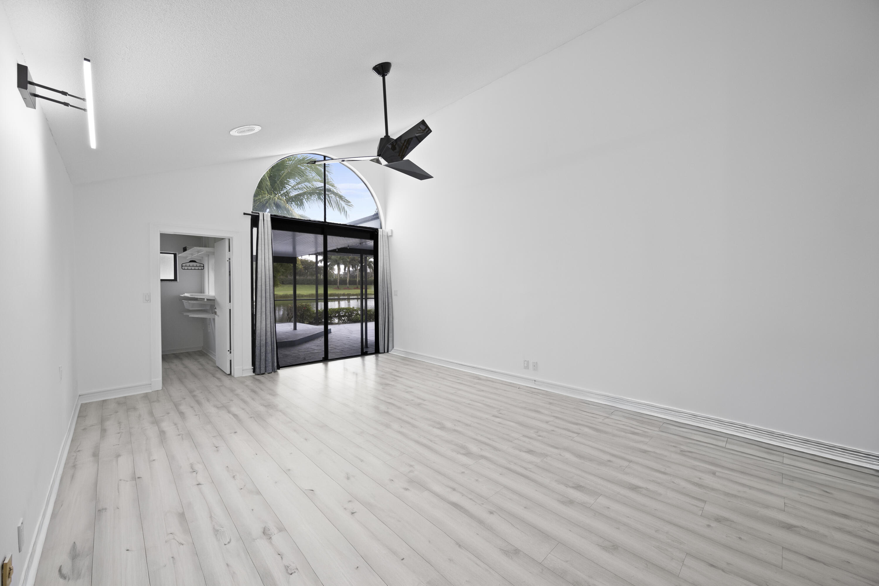 10106 Spyglass Way Boca Raton, FL 33498 - Photo 10 of 56 a view interior of a house with wooden floor door and windows