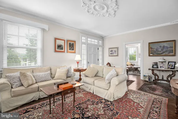 a living room with furniture and a rug
