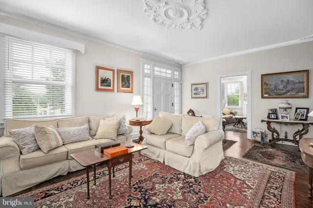 a living room with furniture and a rug
