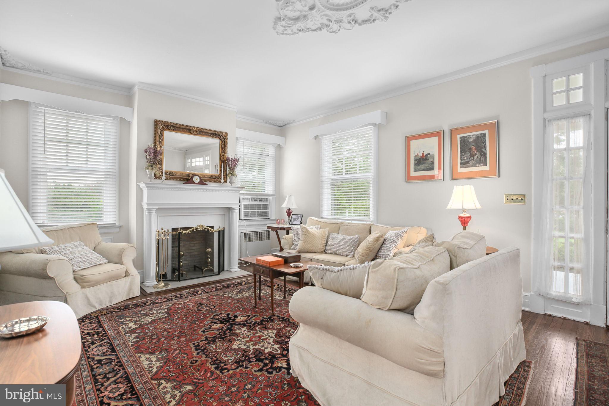 590 North Madison Road Orange, VA 22960 - Photo 16 of 88 a living room with furniture a flat screen tv and a fireplace