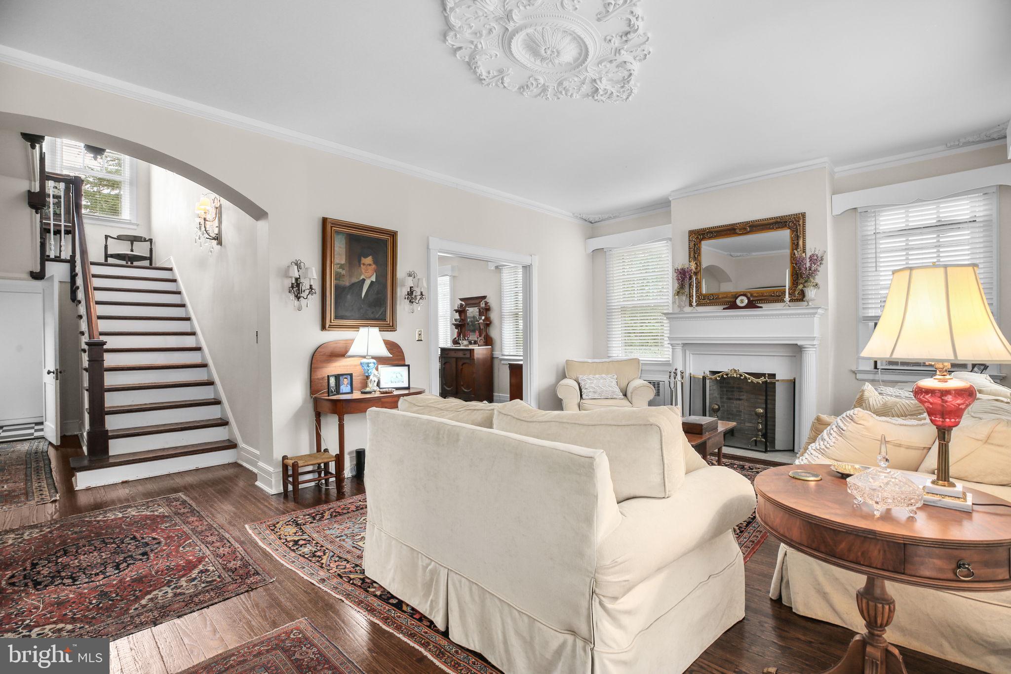 590 North Madison Road Orange, VA 22960 - Photo 17 of 88 a living room with furniture a fireplace and a flat screen tv
