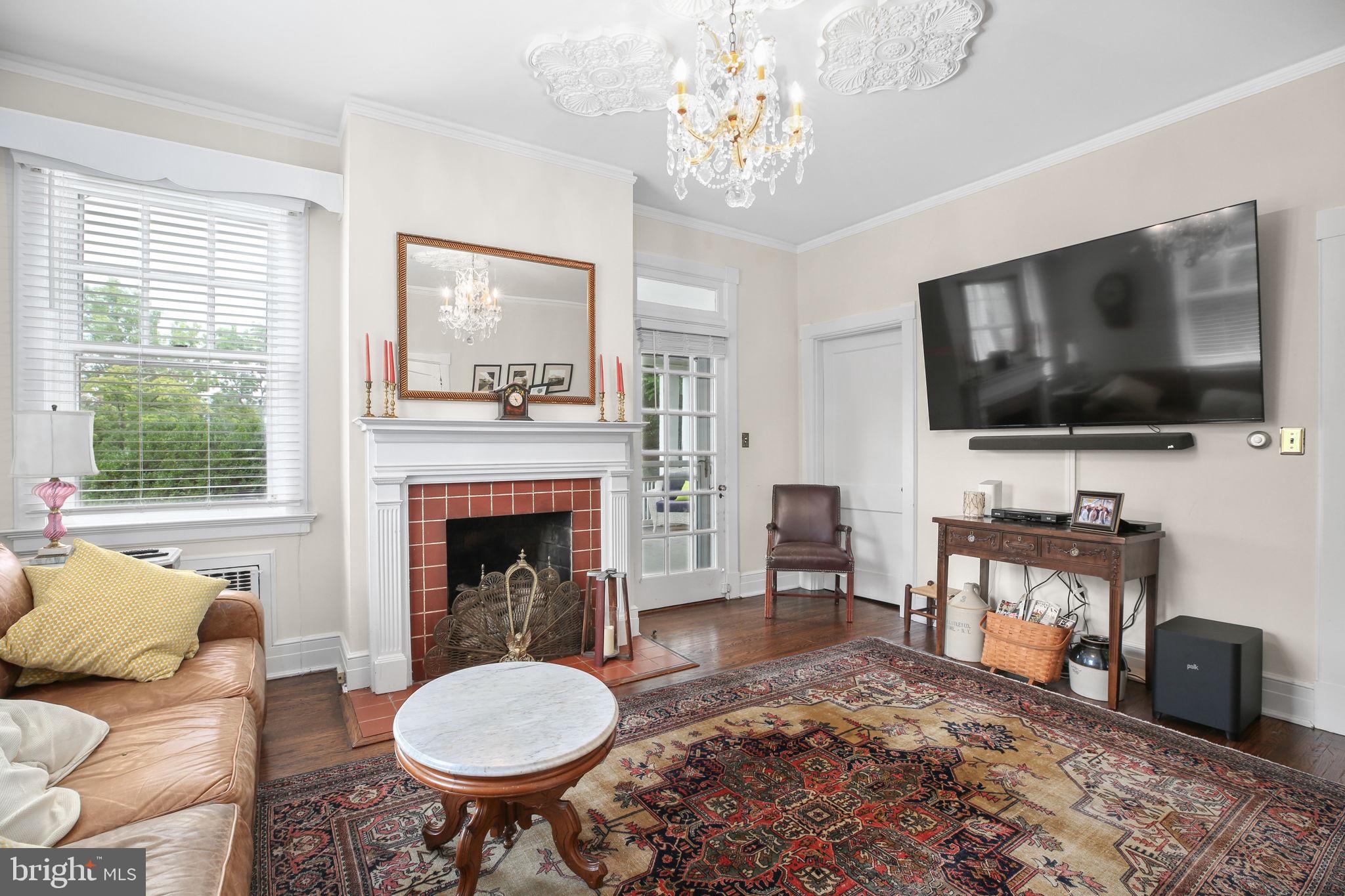 590 North Madison Road Orange, VA 22960 - Photo 21 of 88 a living room with furniture a flat screen tv and a fireplace