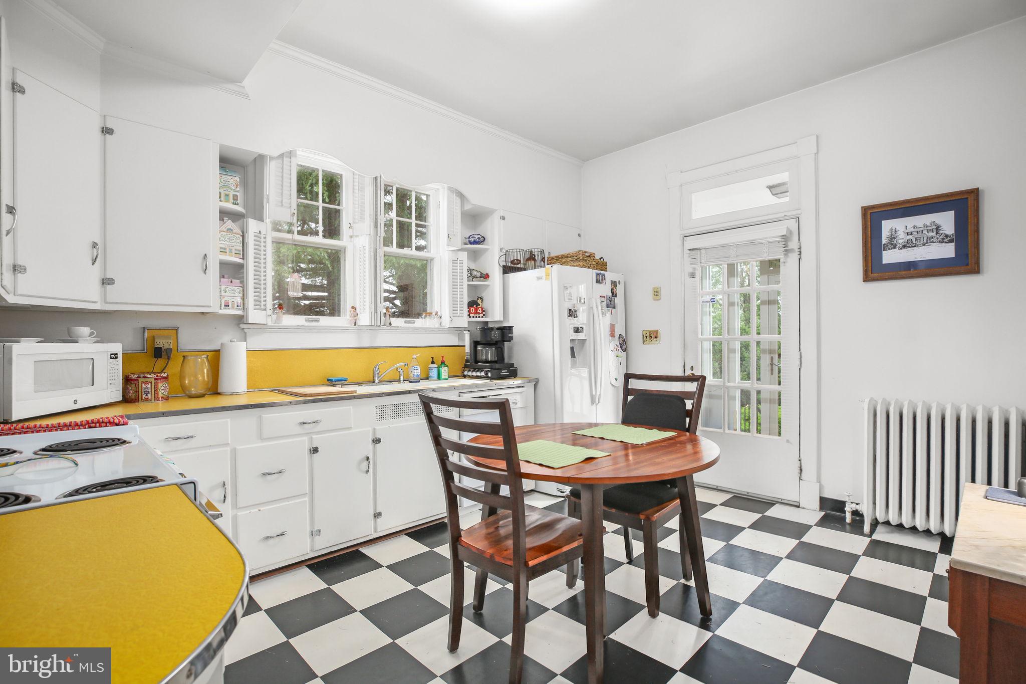 590 North Madison Road Orange, VA 22960 - Photo 22 of 88 a view of a kitchen with a dining table and chair