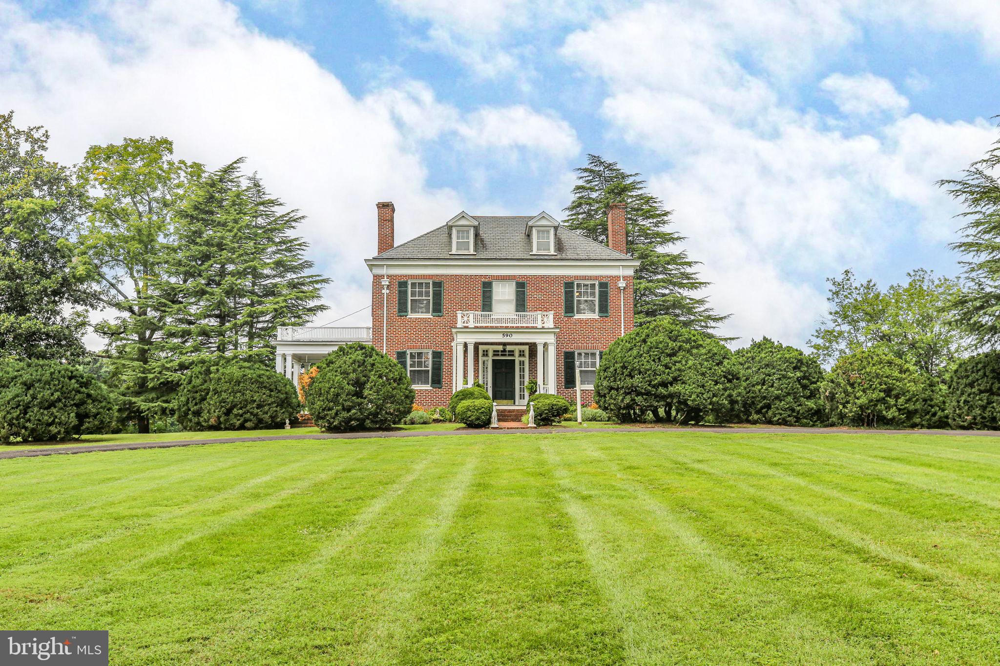 590 North Madison Road Orange, VA 22960 - Photo 3 of 88 a front view of a house with a yard