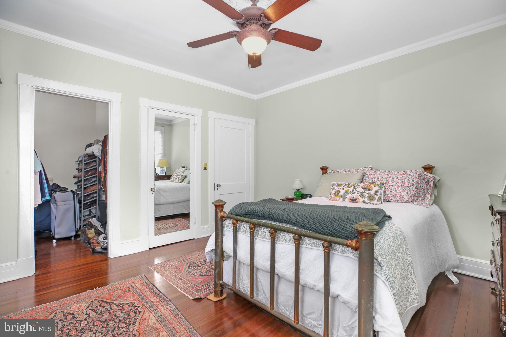 590 North Madison Road Orange, VA 22960 - Photo 32 of 88 a bedroom with a bed and wooden floor