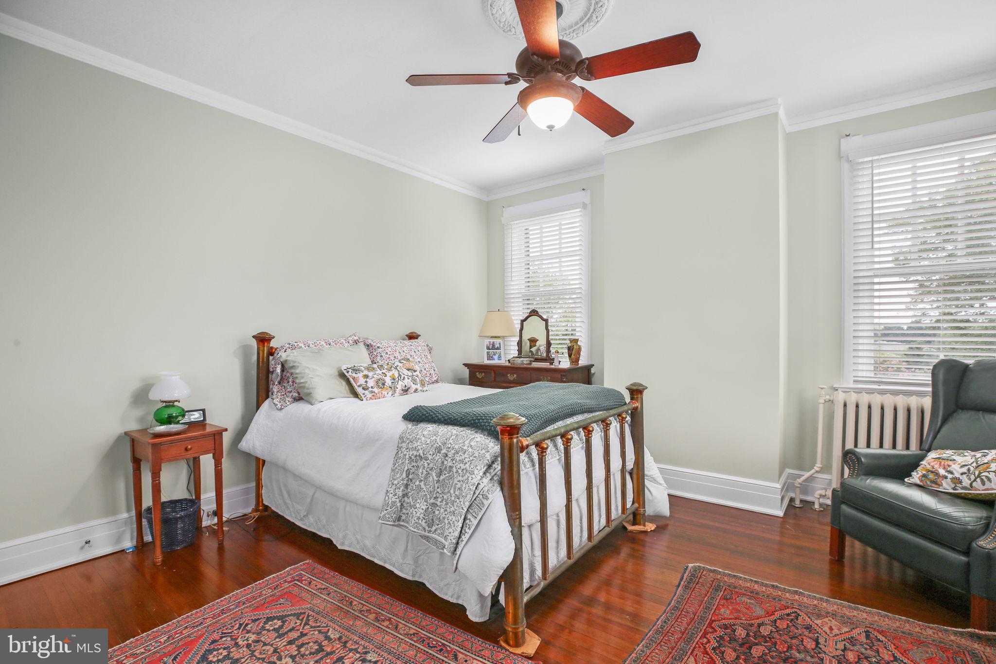 590 North Madison Road Orange, VA 22960 - Photo 33 of 88 a bedroom with a bed and a chandelier