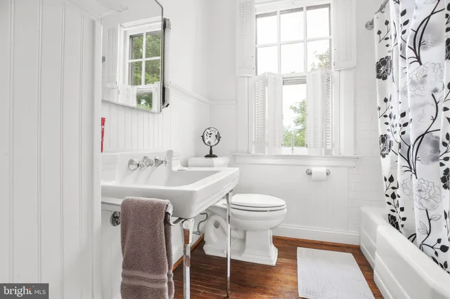 a view of a big yard with large trees