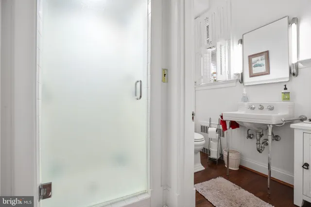 a view of a big yard with plants and large trees