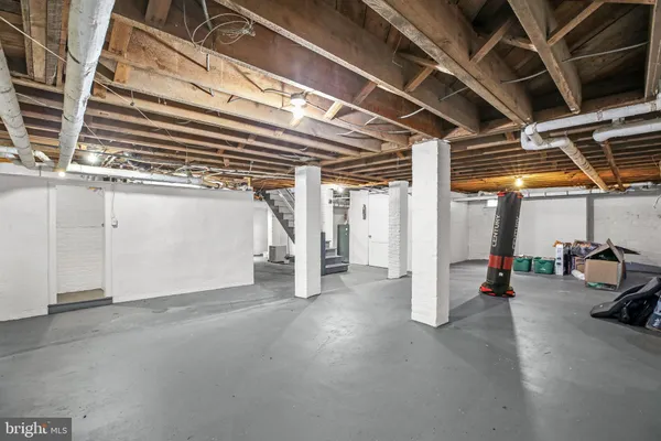 an aerial view of a residential houses with yard