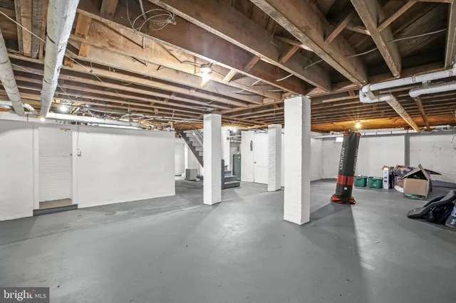 an aerial view of a residential houses with yard