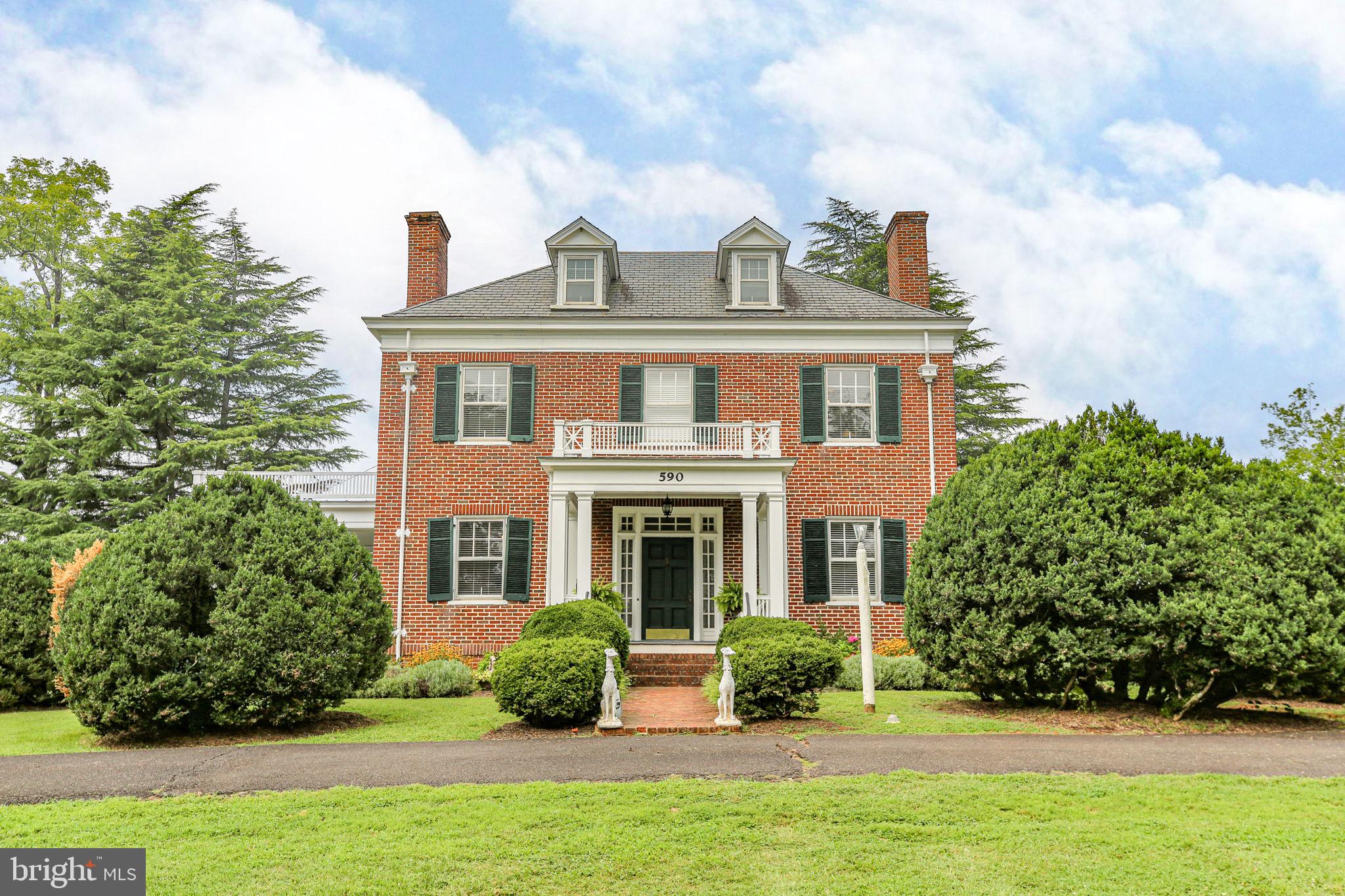 590 North Madison Road Orange, VA 22960 - Photo 5 of 88 a front view of a house with garden