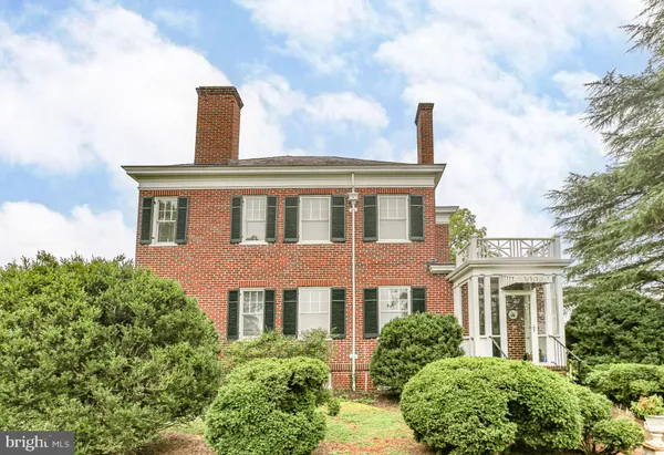 a balcony with furniture and garden view