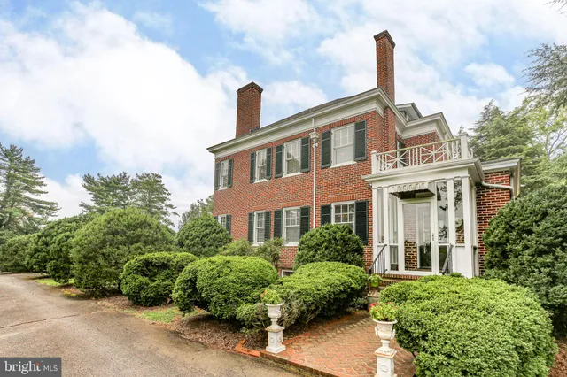 a living room with furniture or couch and two windows