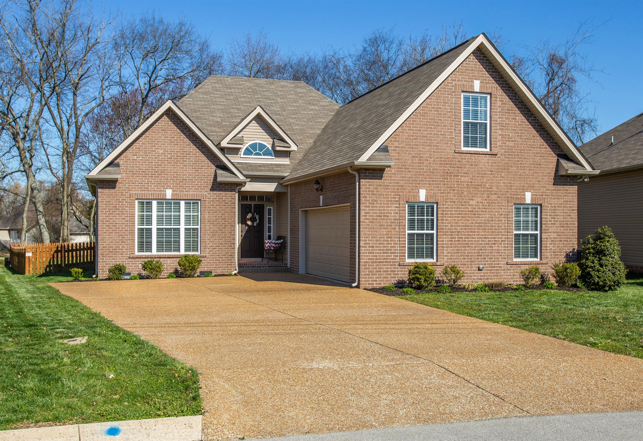 1080 Golf View Way Spring Hill, TN 37174 - Photo 1 of 28 a front view of a house with a yard and garage