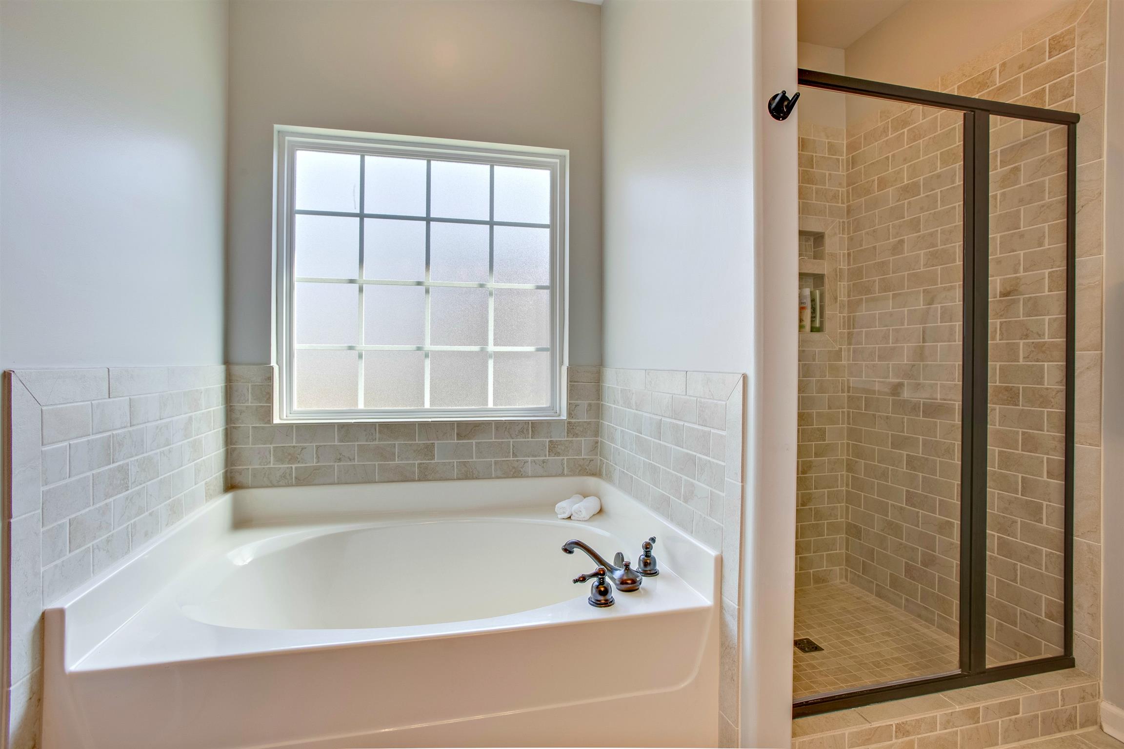 1080 Golf View Way Spring Hill, TN 37174 - Photo 18 of 28 a bathroom with a bathtub and shower