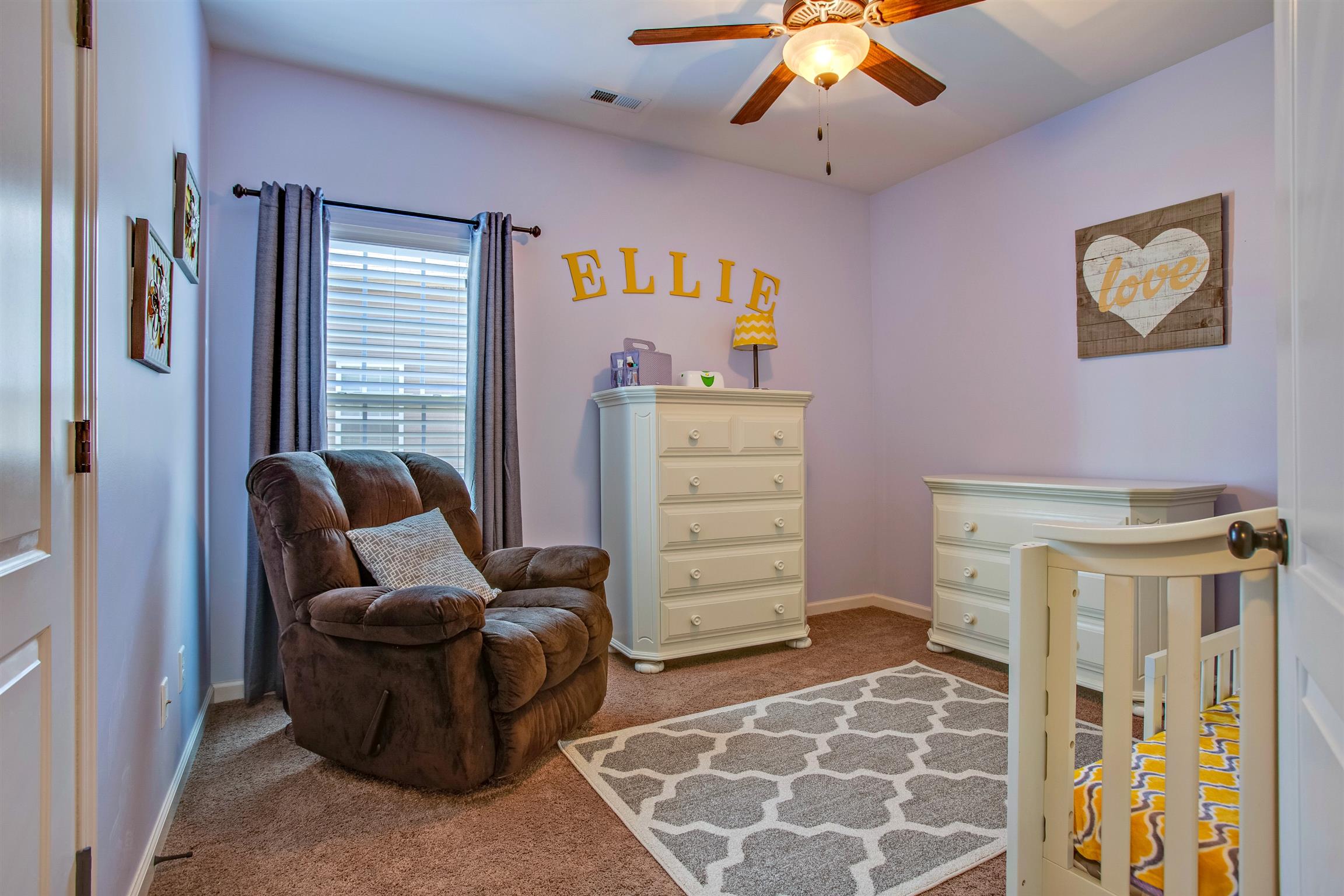 1080 Golf View Way Spring Hill, TN 37174 - Photo 19 of 28 a bedroom with furniture and a chandelier