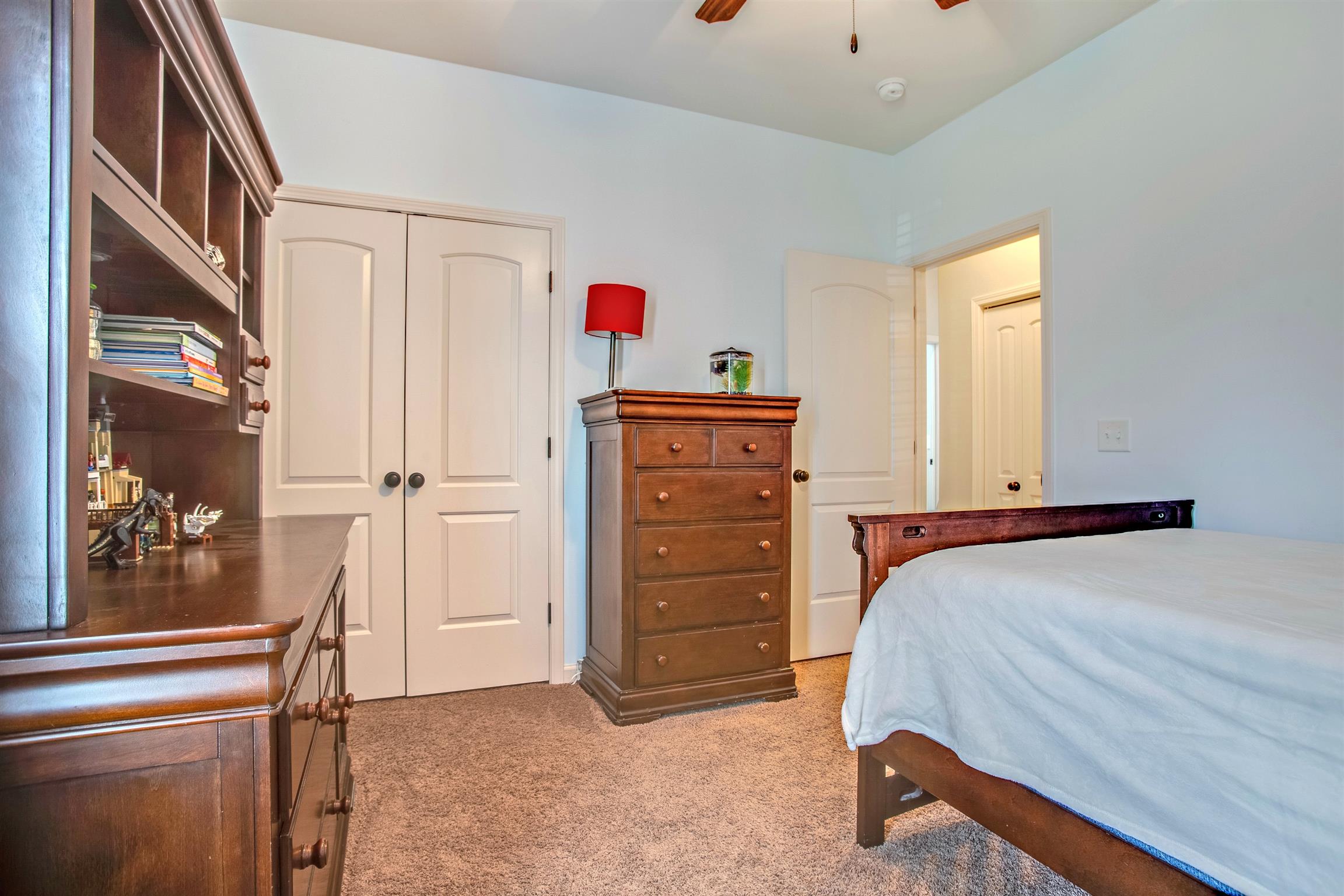 1080 Golf View Way Spring Hill, TN 37174 - Photo 20 of 28 a bedroom with a bed and a dresser