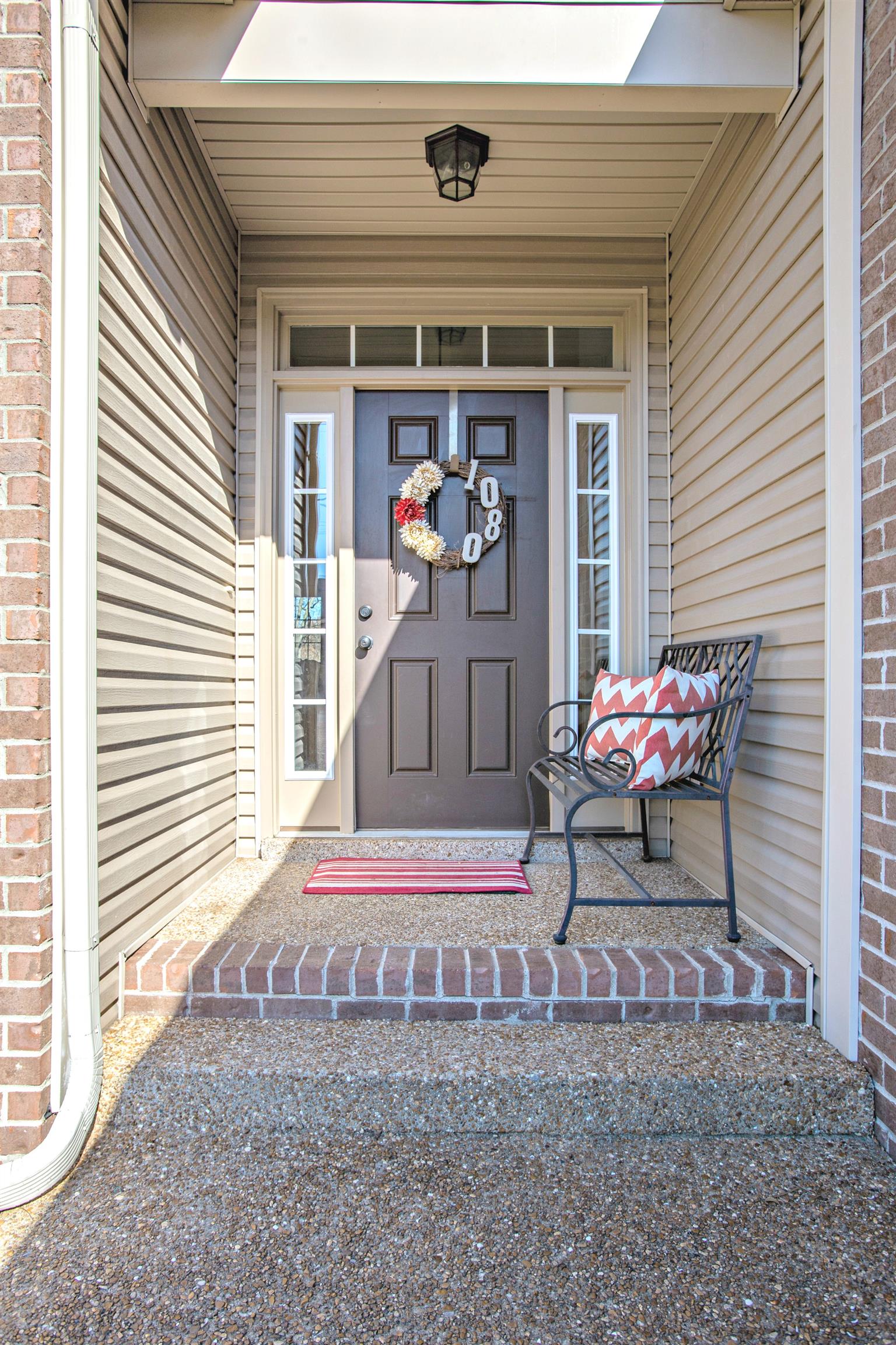 1080 Golf View Way Spring Hill, TN 37174 - Photo 2 of 28 a backyard of a house with table and chairs