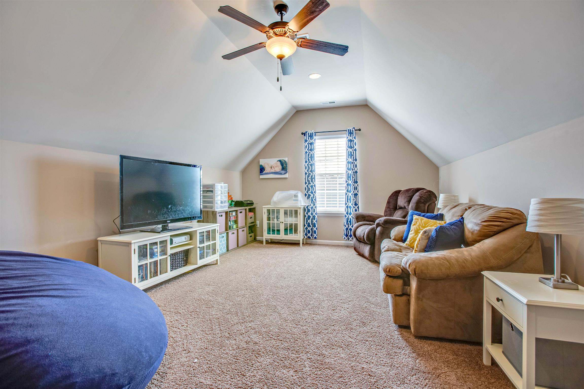 1080 Golf View Way Spring Hill, TN 37174 - Photo 22 of 28 a living room with furniture and a flat screen tv