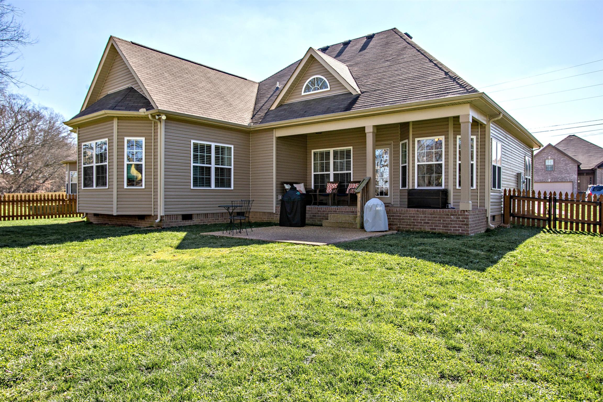 1080 Golf View Way Spring Hill, TN 37174 - Photo 26 of 28 a front view of a house with garden