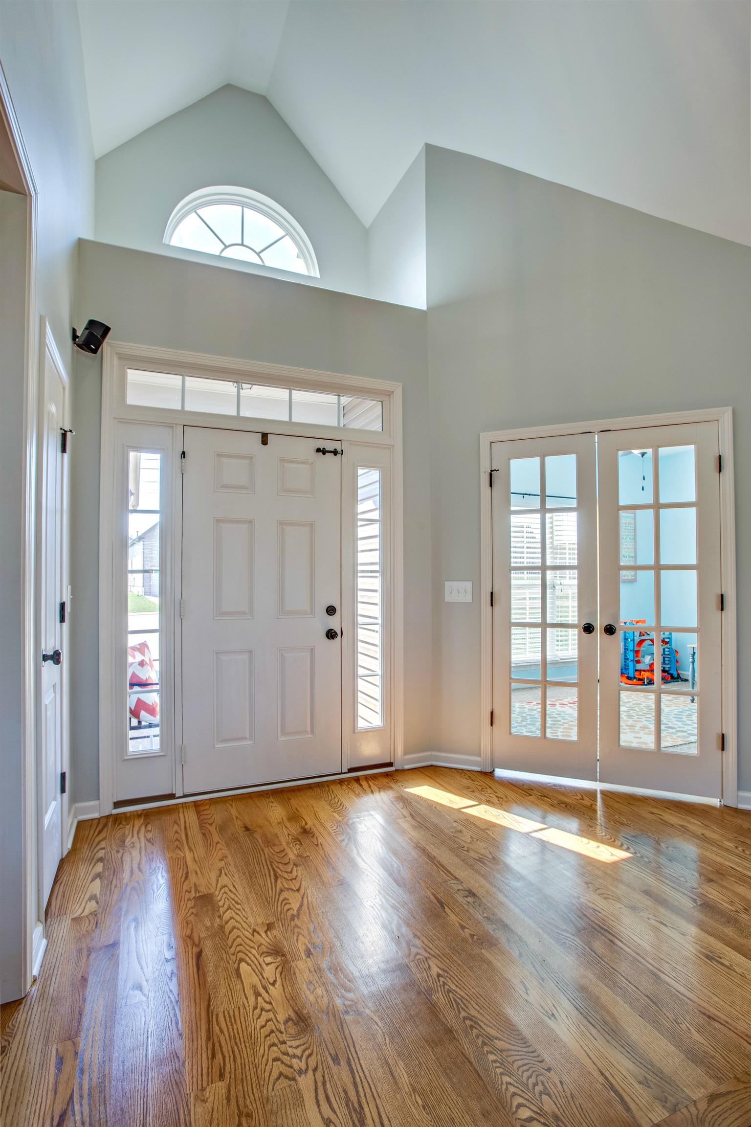 1080 Golf View Way Spring Hill, TN 37174 - Photo 3 of 28 a view of an empty room with window and wooden floor