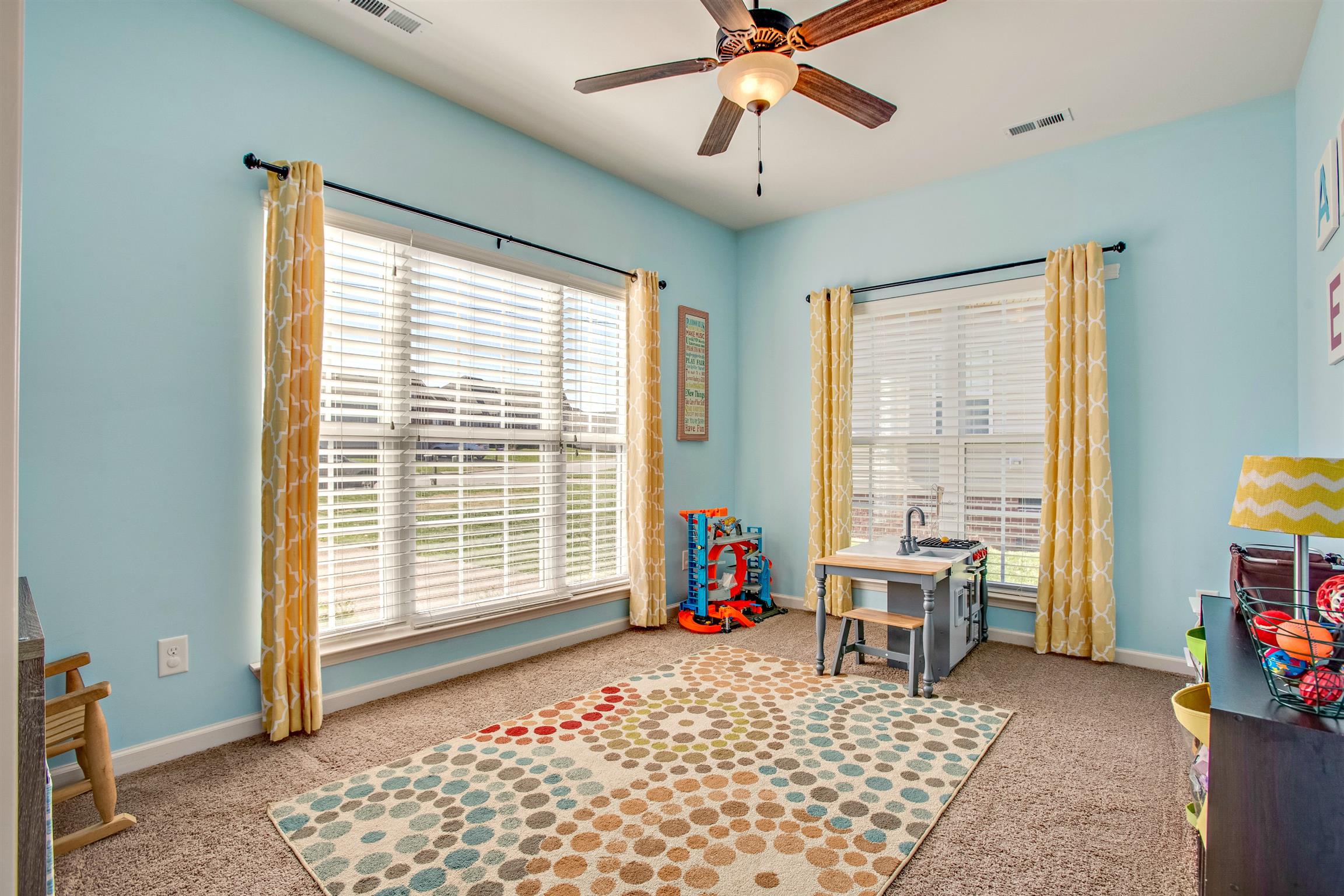 1080 Golf View Way Spring Hill, TN 37174 - Photo 4 of 28 a bedroom with a bed and large windows