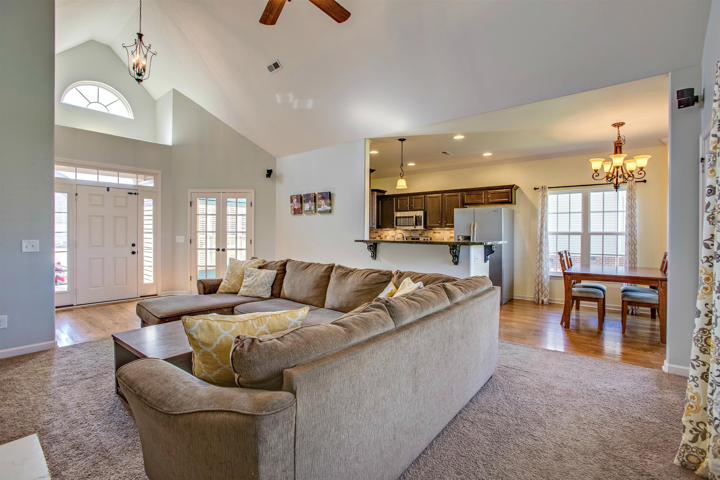 1080 Golf View Way Spring Hill, TN 37174 - Photo 9 of 28 a living room with furniture kitchen view and a large window