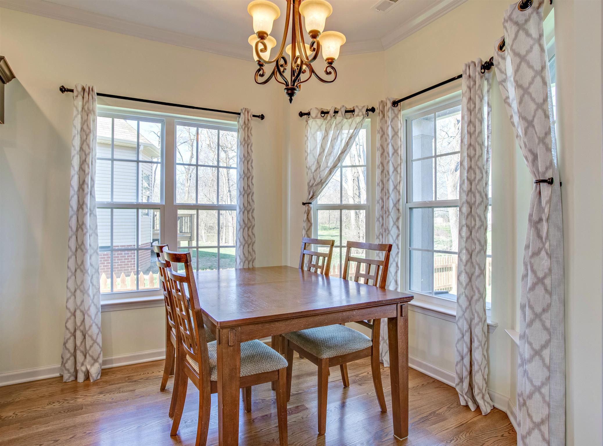 1080 Golf View Way Spring Hill, TN 37174 - Photo 10 of 28 a view of a dining room with furniture window and wooden floor