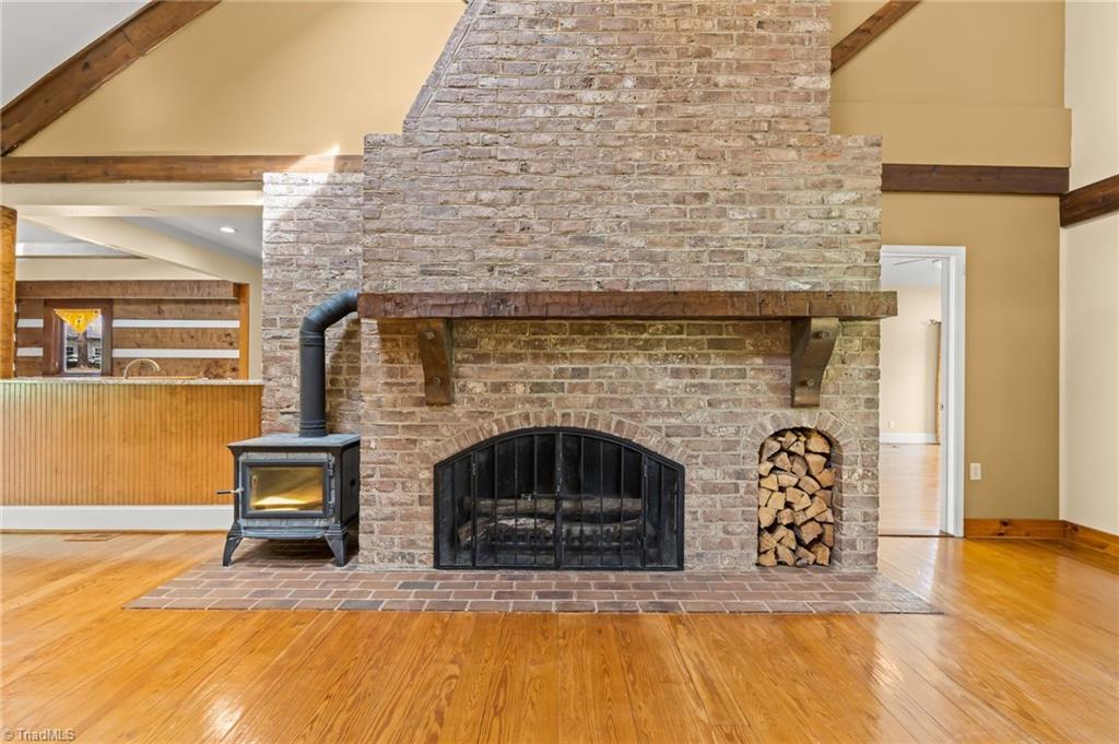 6741 Layton Road Liberty, NC 27298 - Photo 12 of 50 Stone fireplace and wood stove.