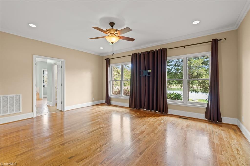 6741 Layton Road Liberty, NC 27298 - Photo 24 of 50 Primary bedroom with beautiful lake view.