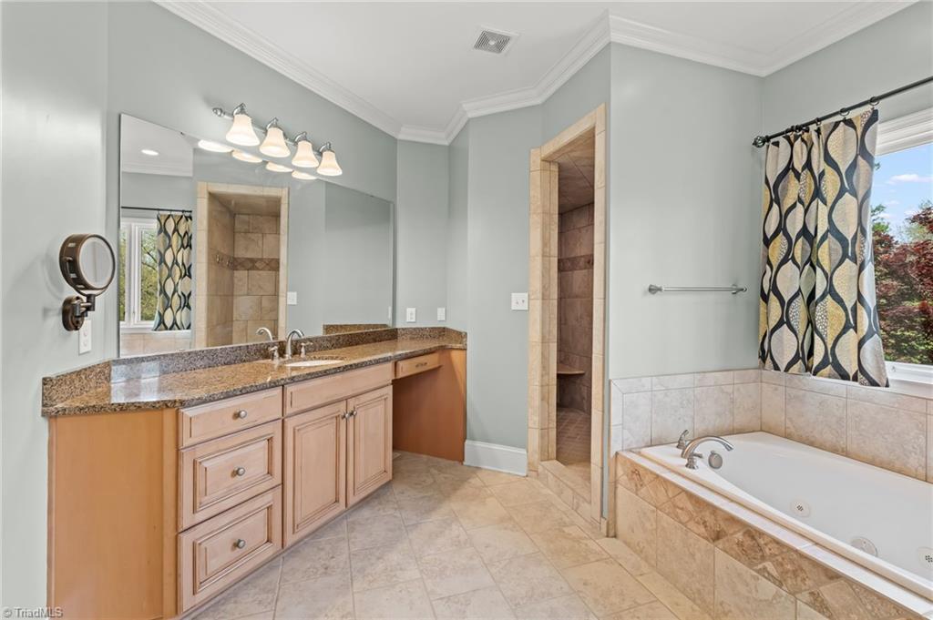 6741 Layton Road Liberty, NC 27298 - Photo 25 of 50 Double vanities in the primary ensuite.