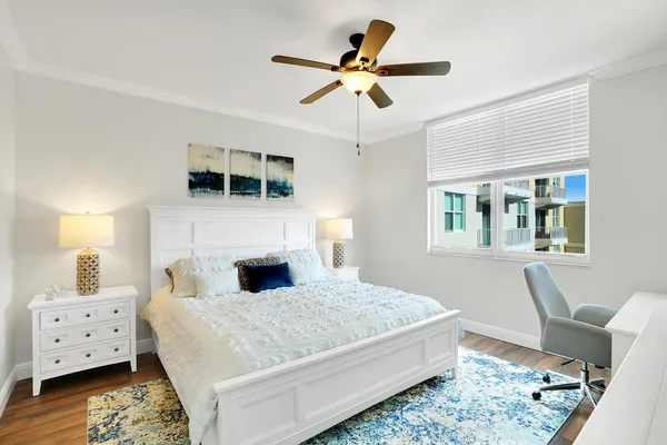 a bedroom with a large bed and a window