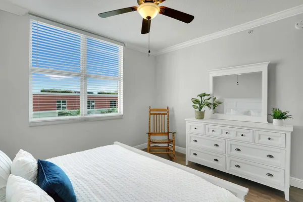 a bedroom with a bed and a dresser