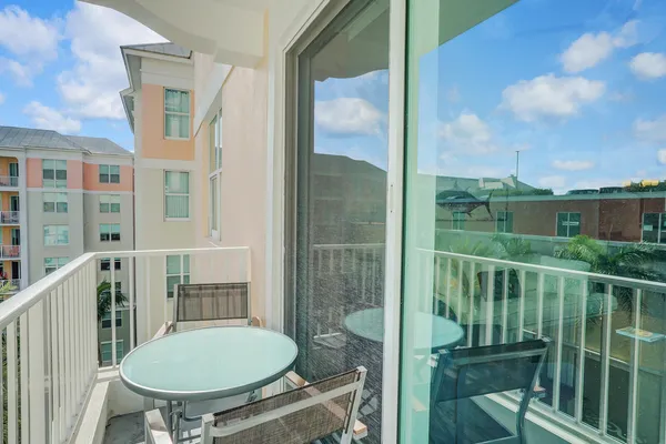 a view of a balcony with chair and glass door