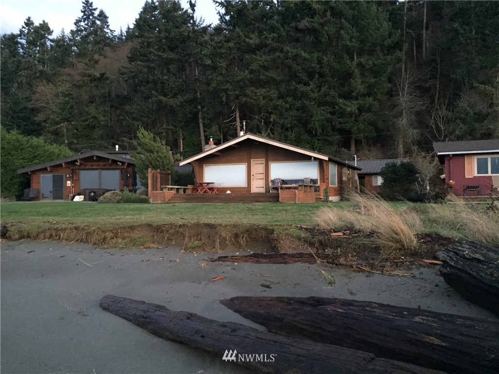 6308 South Bay Road Freeland, WA 98249 - Photo 1 of 5 a front view of a house with garden