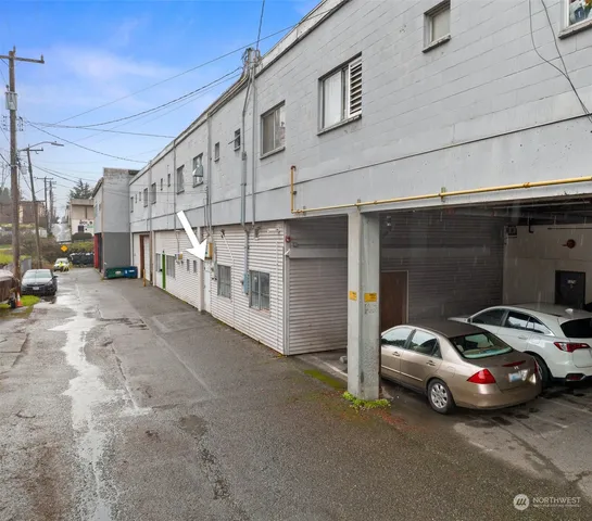a view of parking space with parked cars