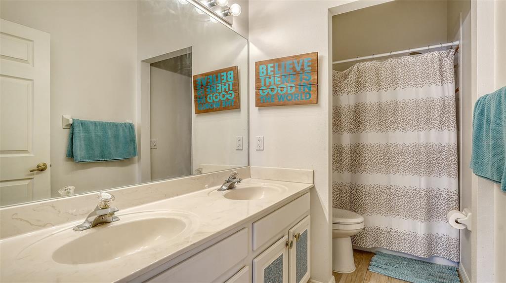 7717 US Open Loop Lakewood Ranch, FL 34202 - Photo 27 of 95 a bathroom with a sink toilet and shower