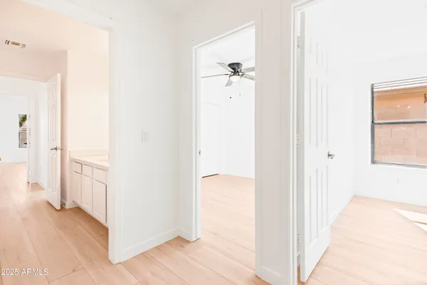 a view of a kitchen from the hallway