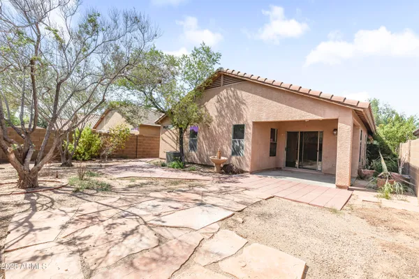 a view of a house with snow on the road