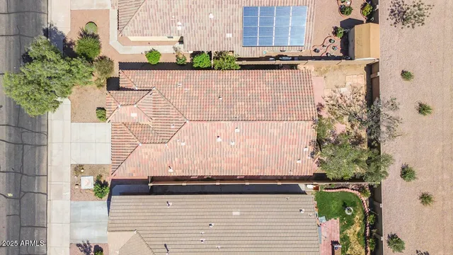 an aerial view of a city with lots of residential buildings and ocean view
