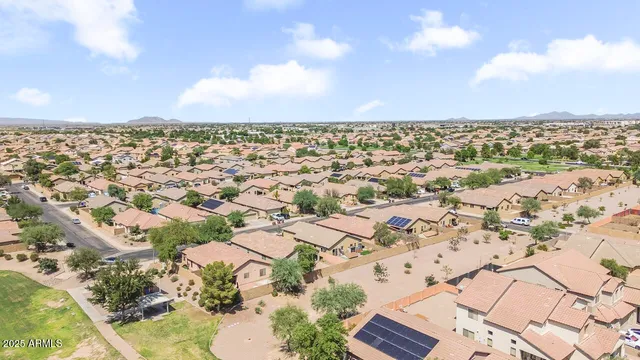 an aerial view of residential houses with outdoor space