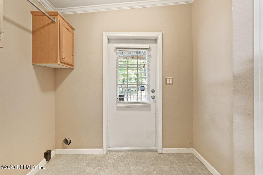 18066 Wells Road Jacksonville, FL 32234 - Photo 15 of 50 a view of an empty room with windows