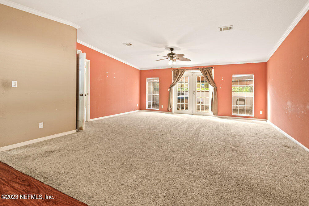 18066 Wells Road Jacksonville, FL 32234 - Photo 19 of 50 a view of an empty room with a window