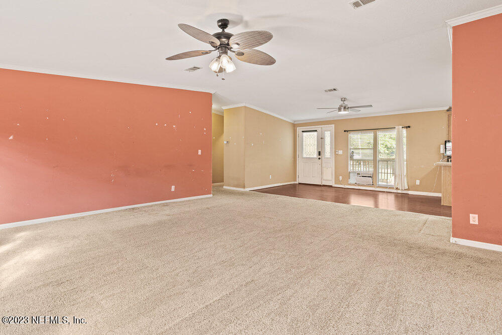 18066 Wells Road Jacksonville, FL 32234 - Photo 21 of 50 a view of an empty room with a window