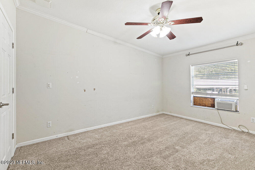 18066 Wells Road Jacksonville, FL 32234 - Photo 32 of 50 a view of an empty room with a window